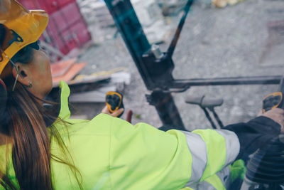 Woman driving construction vehicle