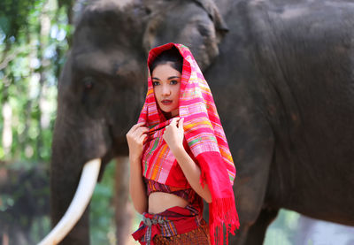 Portrait of smiling girl standing outdoors