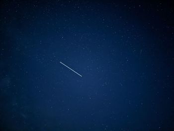 Low angle view of vapor trails in sky