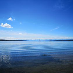 Scenic view of sea against blue sky