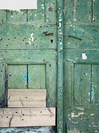 Close-up of green old wooden door