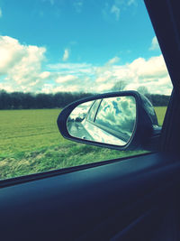 Reflection of car on side-view mirror