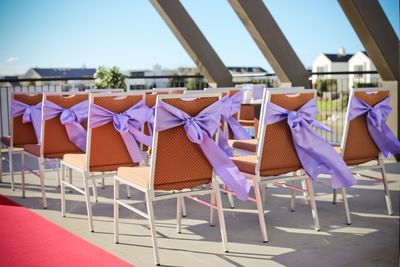 Chairs against blue sky