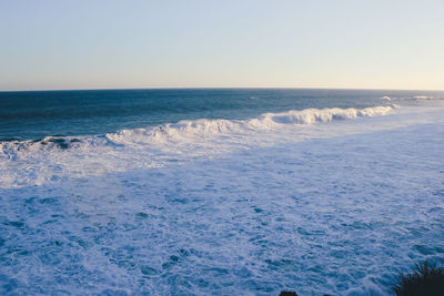 Scenic view of sea against clear sky