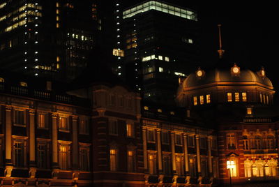 Low angle view of illuminated building at night