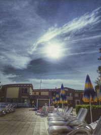 Panoramic view of amusement park against sky on sunny day