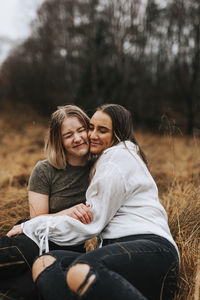 Friends sitting on field