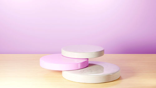 Close-up of pink bottles on table