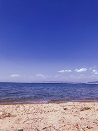 Scenic view of sea against blue sky