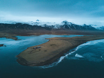 Scenic view of frozen lake against sky