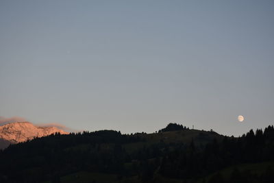 Scenic view of silhouette mountains against clear sky