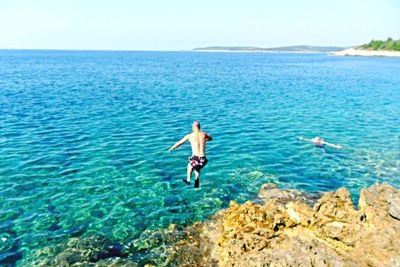 Man swimming in sea