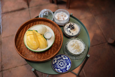 High angle view of fruits in plate on table