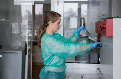 Researchers in the medical laboratory process human samples