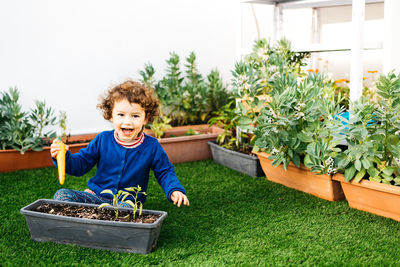 Portrait of cute boy smiling in yard