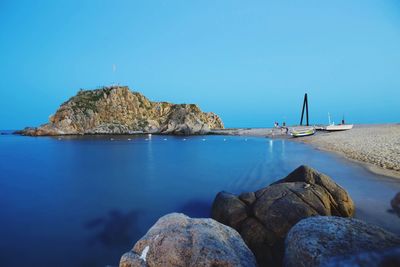 Scenic view of beach against clear sky