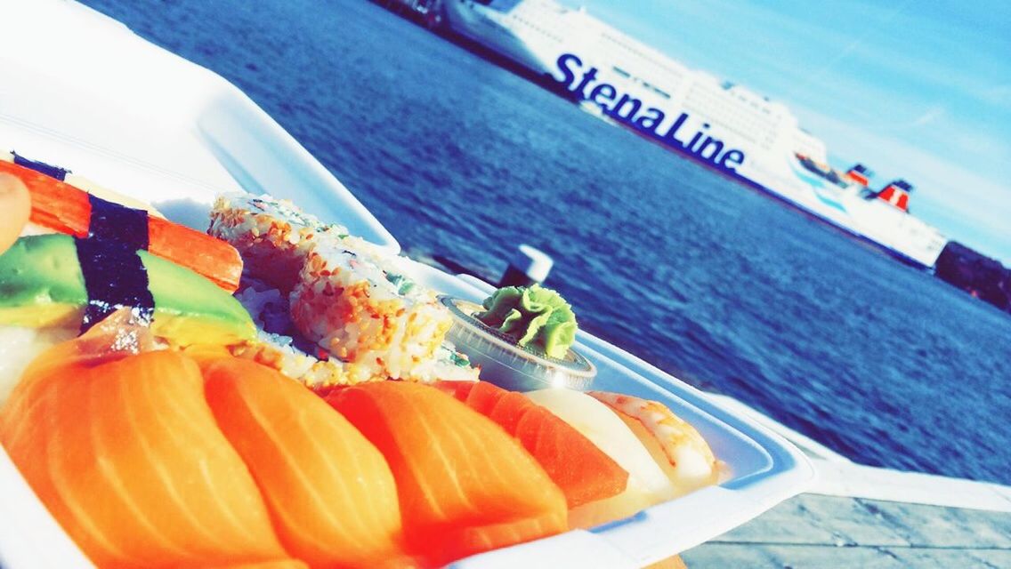 food and drink, food, healthy eating, freshness, water, transportation, sea, nautical vessel, mode of transport, cropped, high angle view, vegetable, day, boat, part of, no people, orange color, variation, fruit, outdoors