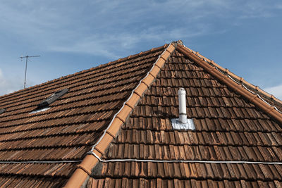 Low angle view of roof against sky