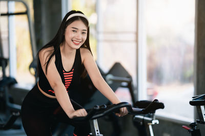 Portrait of young woman in gym