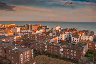 High angle view of built structures against calm sea