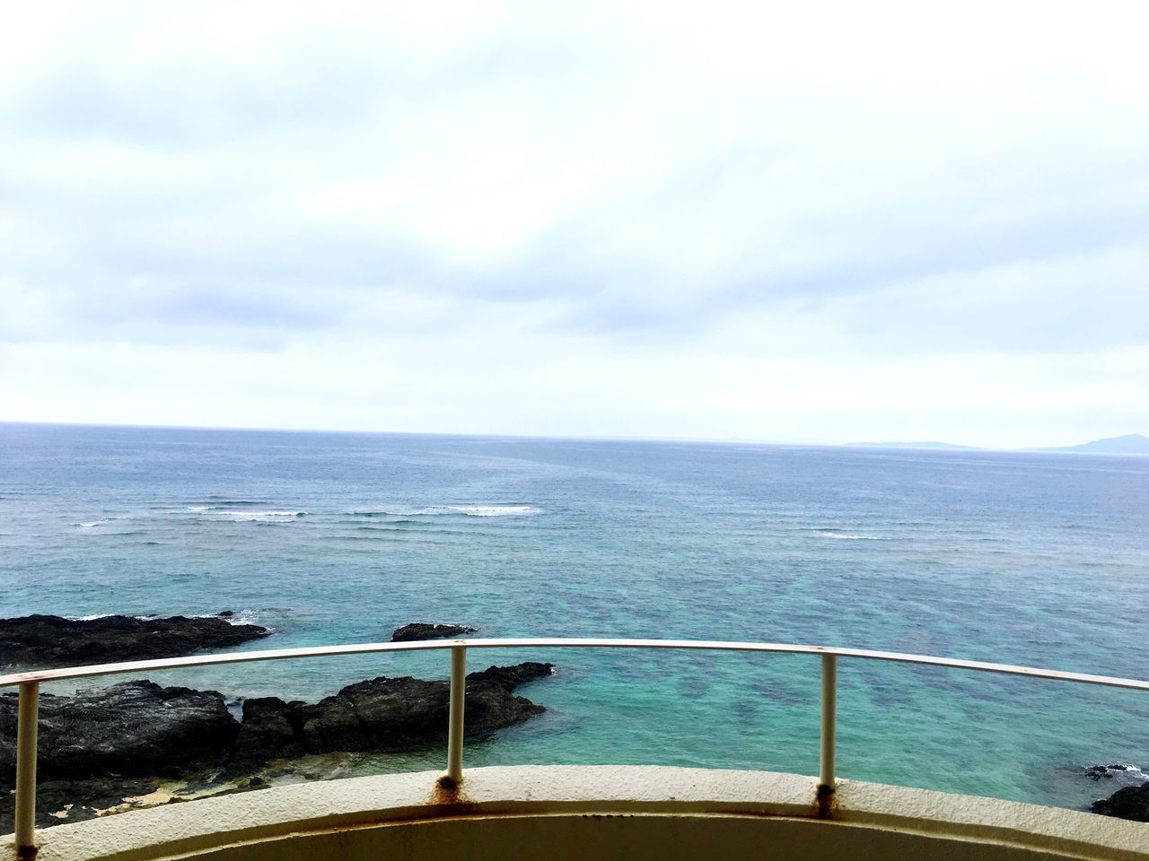 sea, water, horizon over water, sky, tranquil scene, scenics, tranquility, beauty in nature, railing, nature, cloud - sky, idyllic, cloud, beach, pier, day, transportation, remote, calm, outdoors