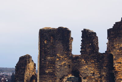 Low angle view of old building against clear sky