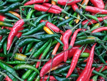 Full frame shot of red and green chili peppers