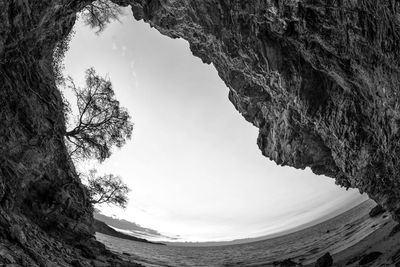 Low angle view of rock formation against sky