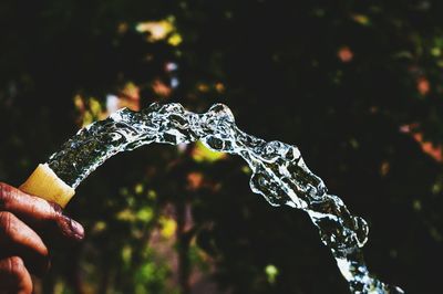 Close-up of cropped hand holding object