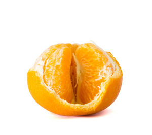 Close-up of orange slice against white background