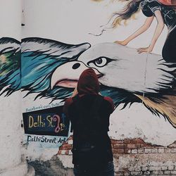 Man standing on wall