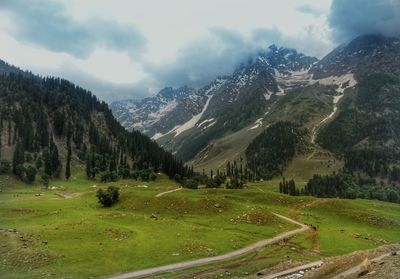 Scenic view of landscape and mountains against sky