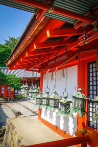 Illuminated lanterns hanging outside building