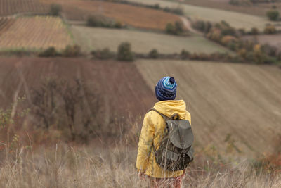 Rear view of man on field