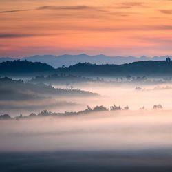 Scenic view of landscape against sky during sunset