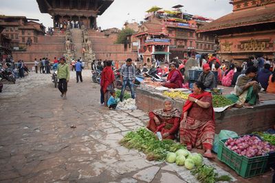 People at market stall