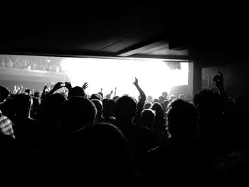 People enjoying music concert at night