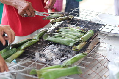 Midsection of man preparing food