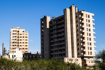 Low angle view of modern buildings against sky