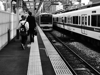 People on railroad station platform