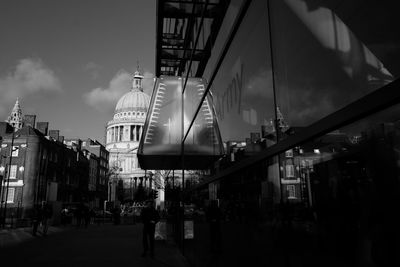People in city against sky