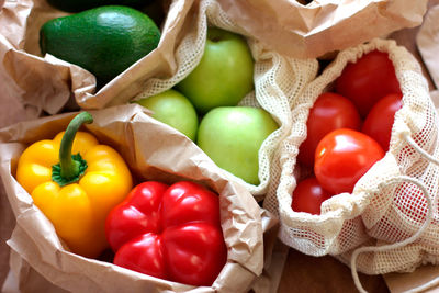 Zero waste shopping. eco bags with fruits and vegetables in tote, sustainable lifestyle concept.  