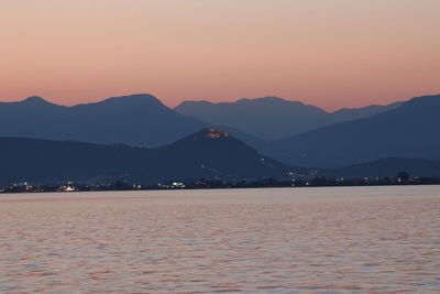 Scenic view of silhouette mountains against sky during sunset