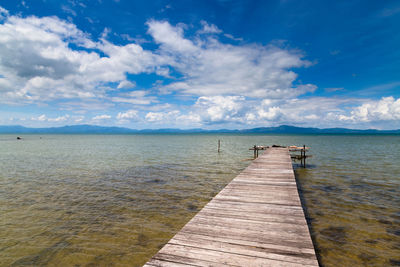 Pier over sea against sky