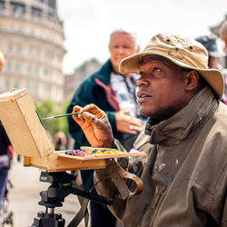 Man holding food outdoors