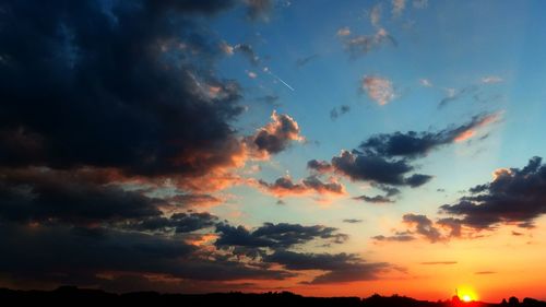 Low angle view of dramatic sky during sunset