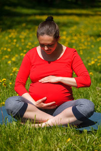 Young woman sitting on field