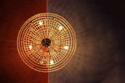 Low angle view of illuminated chandelier