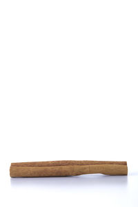 Close-up of bread against white background
