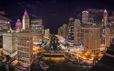 Illuminated buildings in city at night